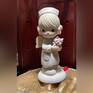 Retired: Precious Moment “mercy angel” nurse